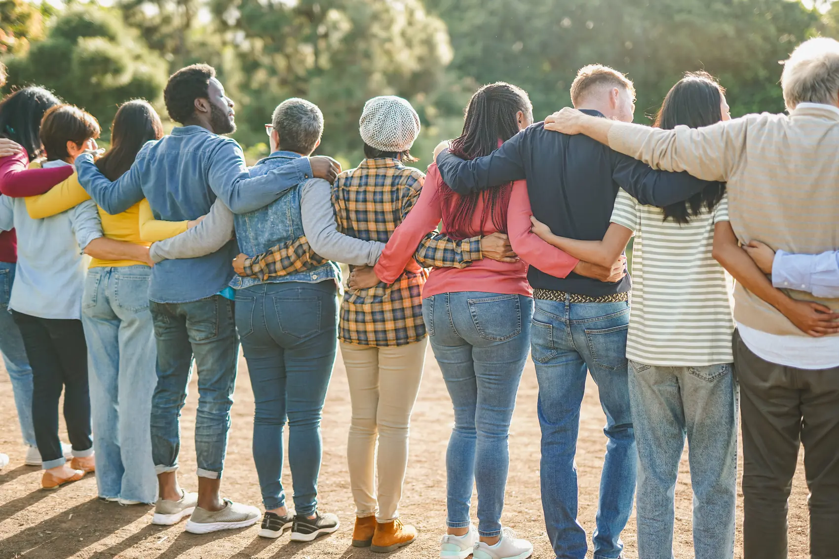 A group of people hugging and connecting