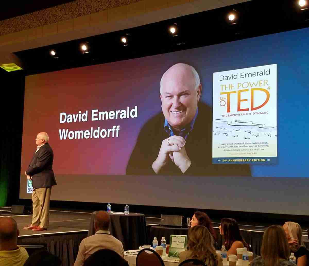 David Emerald Womeldorff speaking at a conference